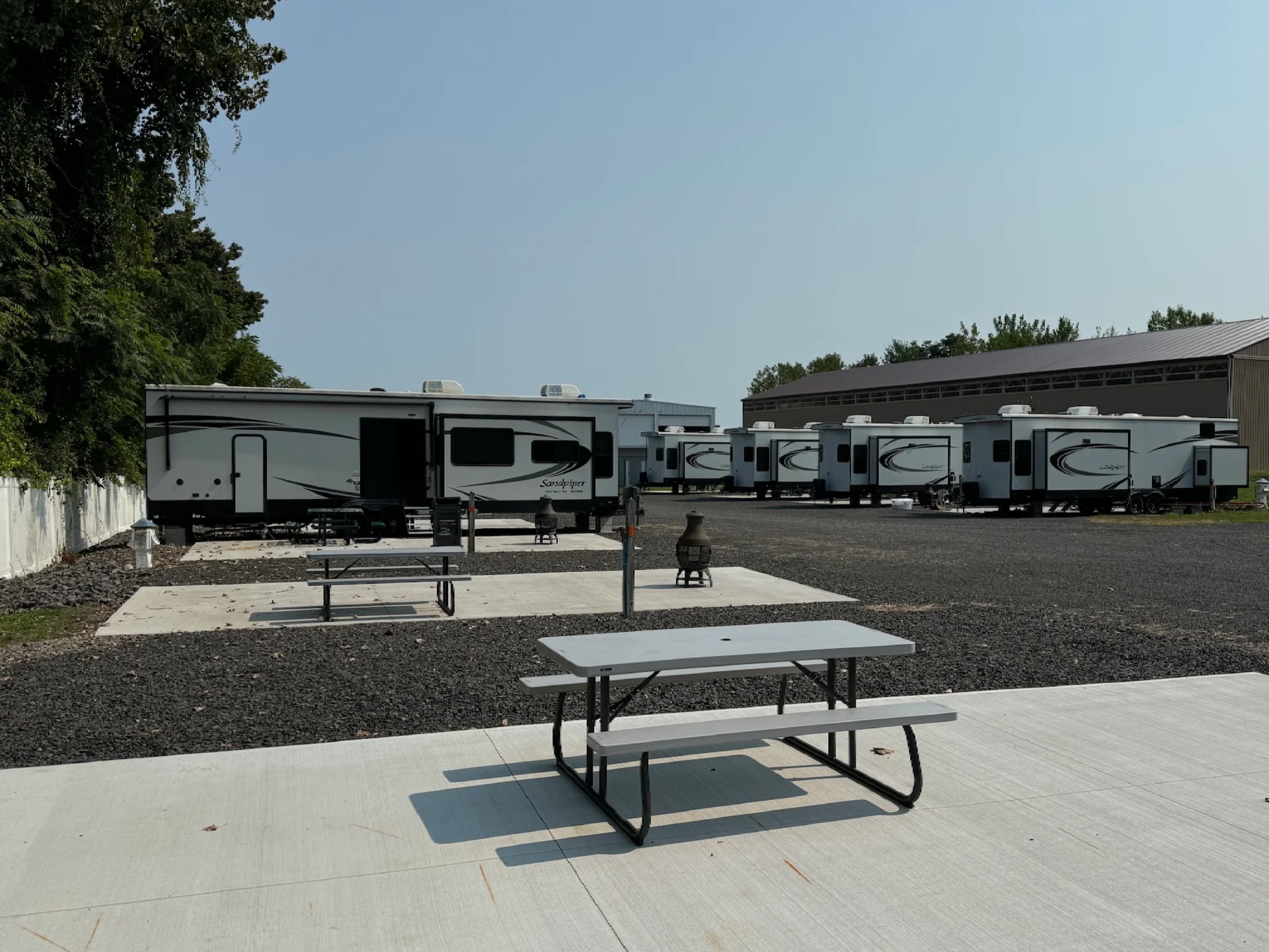 A group of recreational vehicles parked in the parking lot.